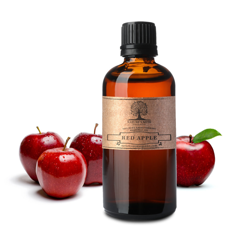 Glass Bottle Of Apple Essential Oil Near Fresh Apples On A Wooden Table.  Essential Oil Is Used To Fill Lamps, Perfumes And In Cosmetics. Close-up.  Stock Photo, Picture and Royalty Free Image.